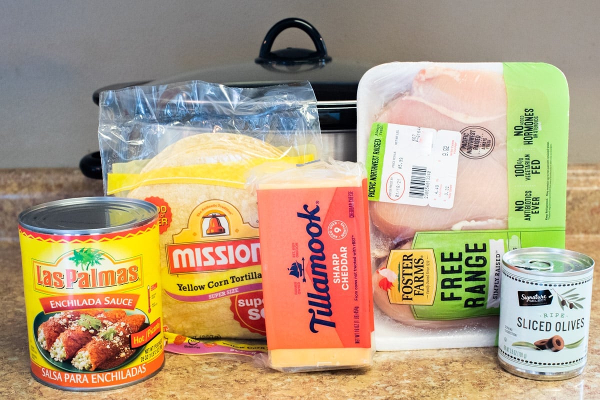 ingredients for enchilada casserole in front of slow cooker.