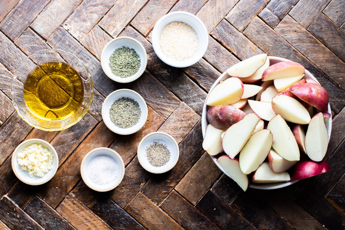 ingredients for garlic parmesan potatoes on wood table