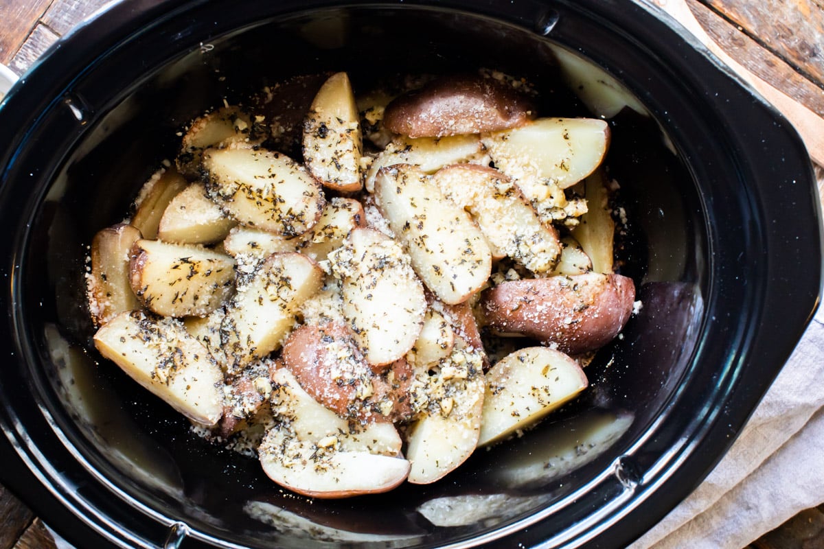 cooked garlic parmesan potatoes in slow cooker