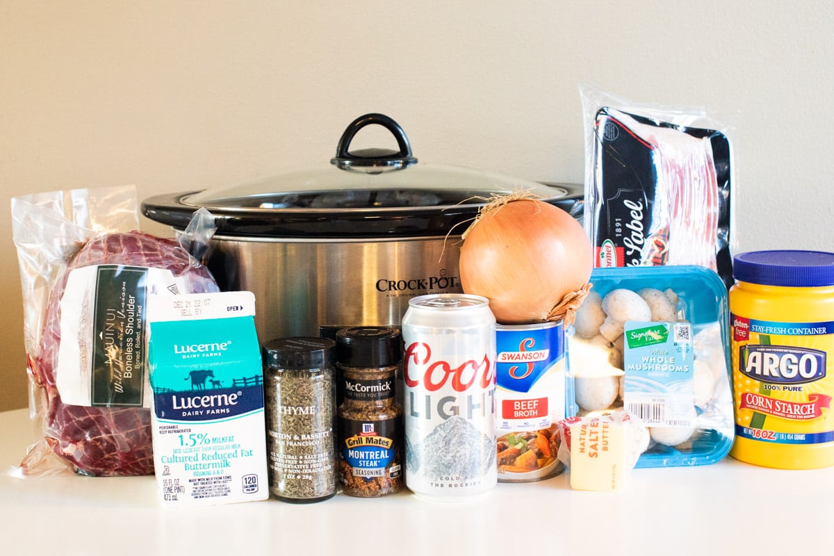 ingredients for venison with mushroom gravy lined up in front of slow cooker