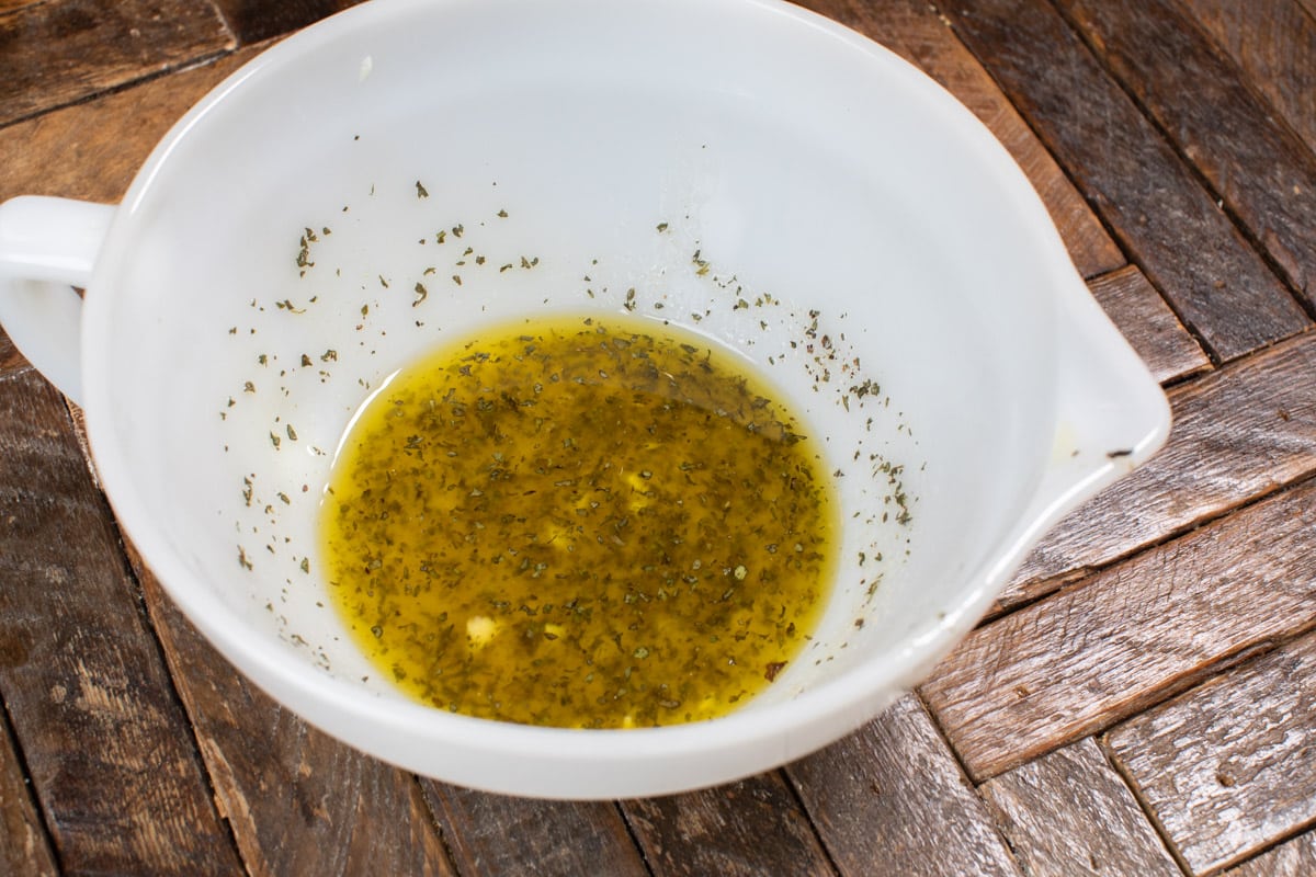 homemade Italian dressing in white bowl