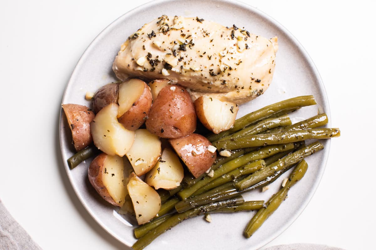 plated chicken potatoes and green beans