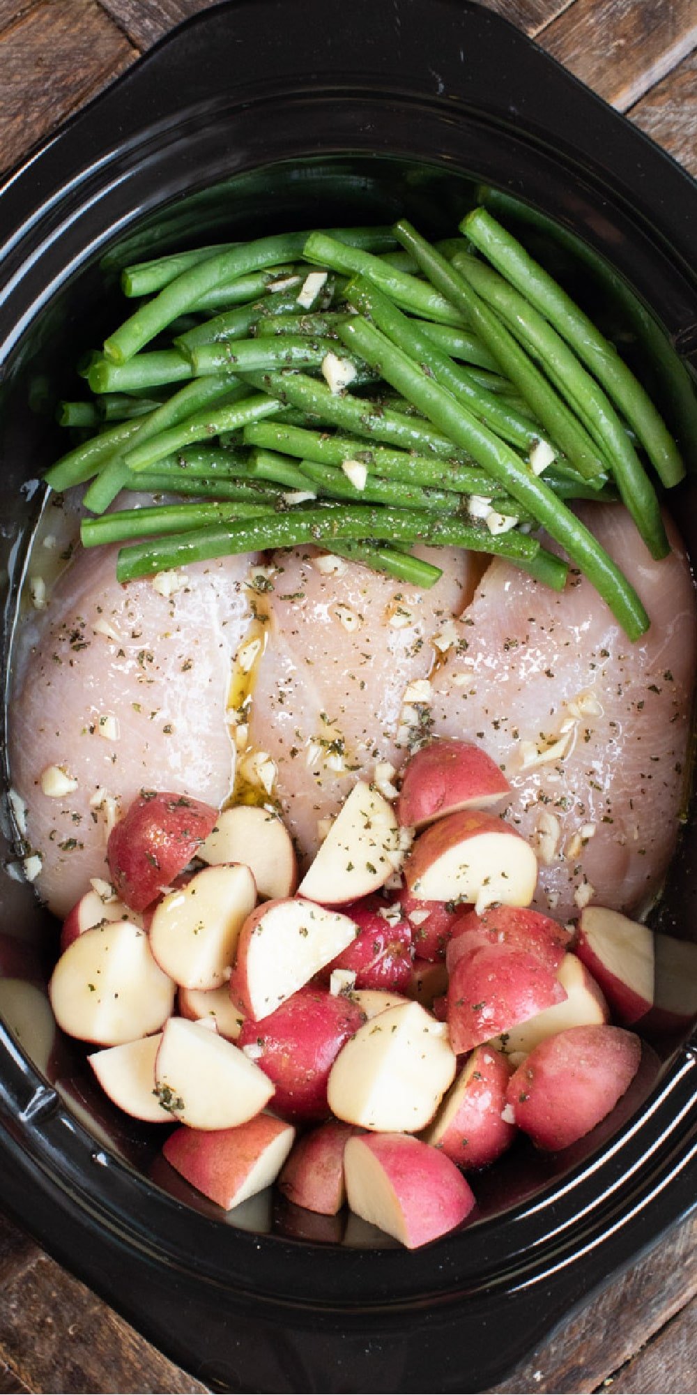seasoned chicken and veggies uncooked.