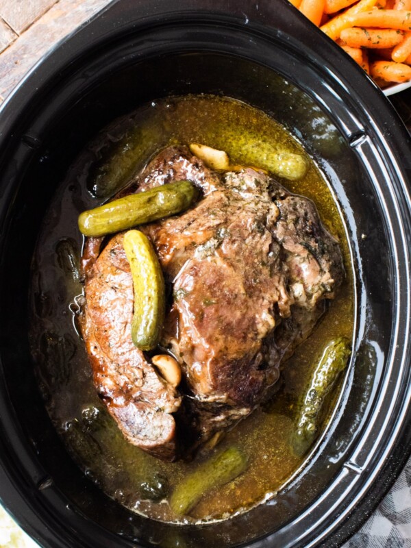 cooked chuck roast with pickles on top