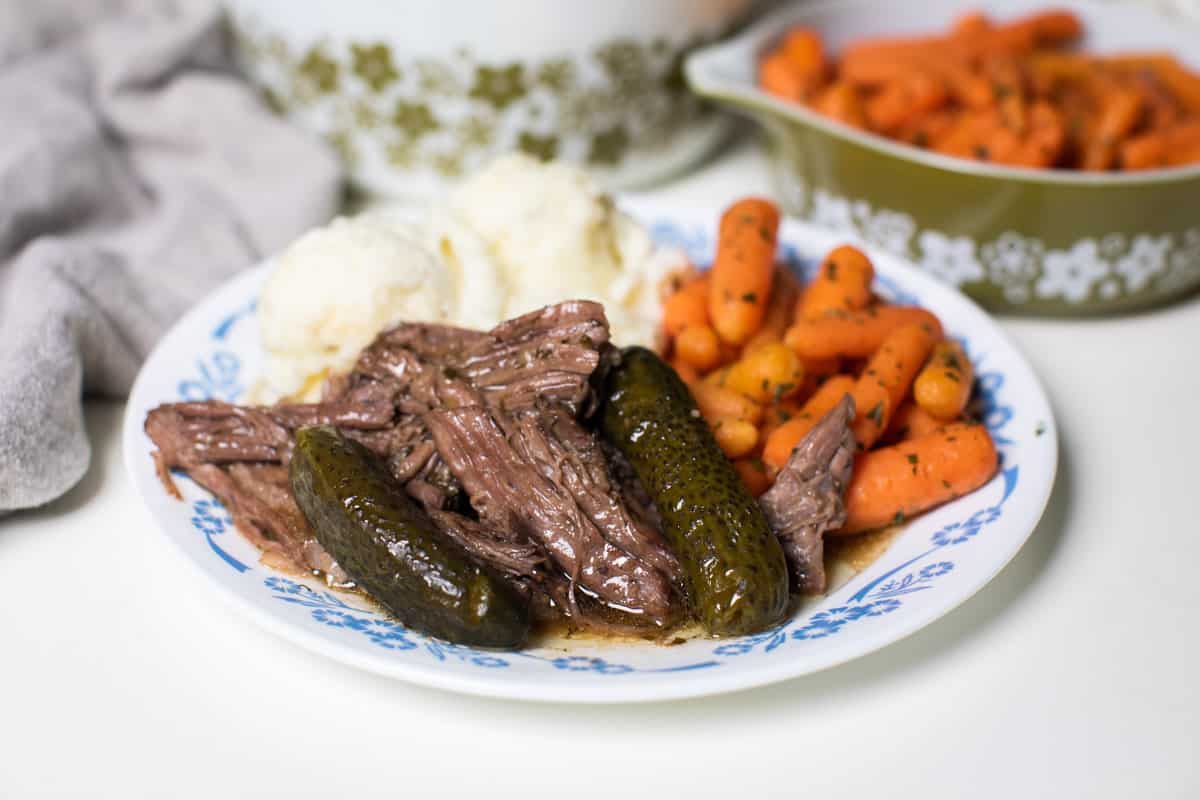 shredded beef with pickles on plate