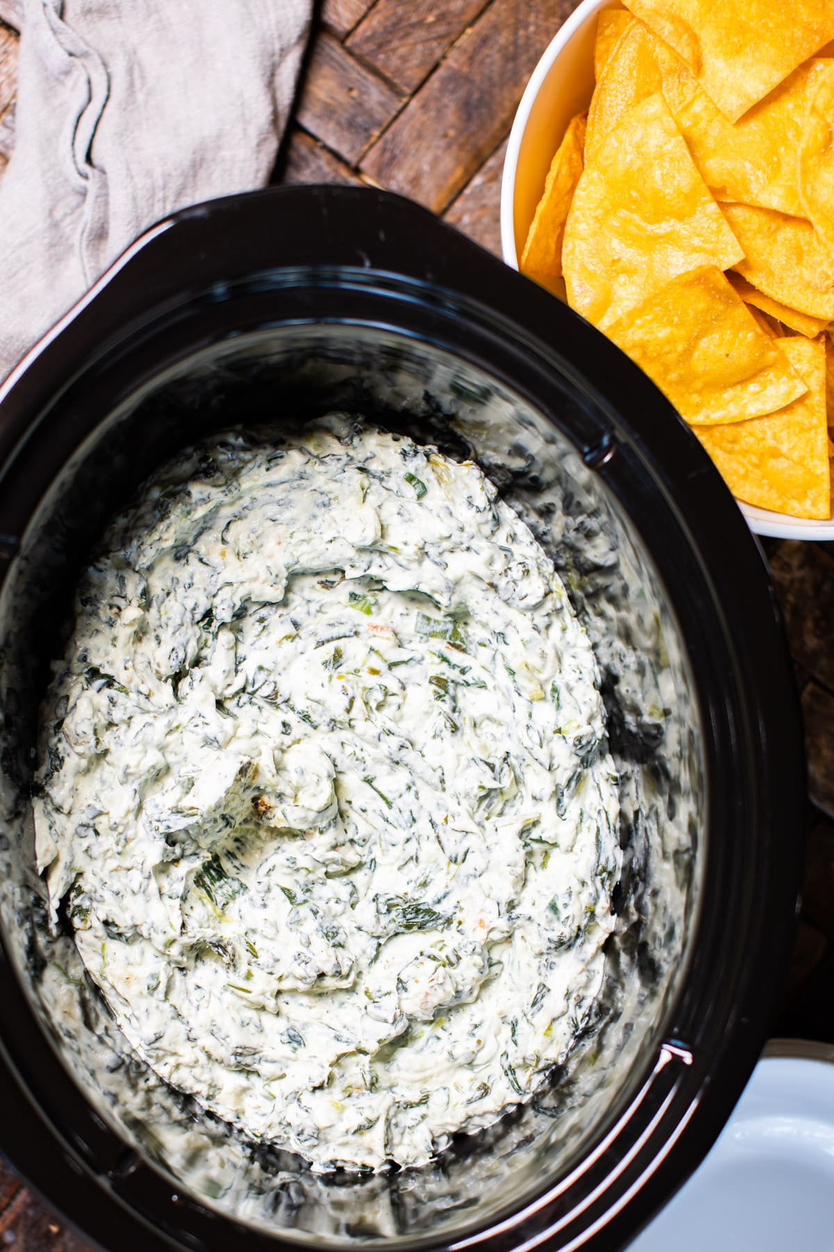 spinach dip, done cooking in a slow cooker