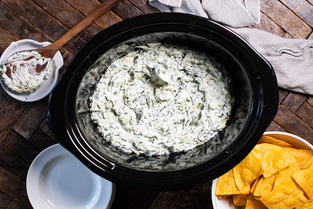 spinach dip with corn chips on the side