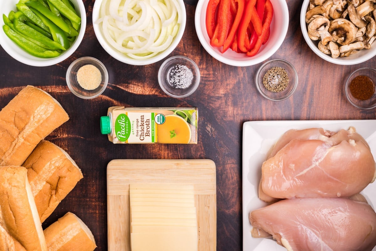 ingredients for chicken philly cheesesteaks on a table