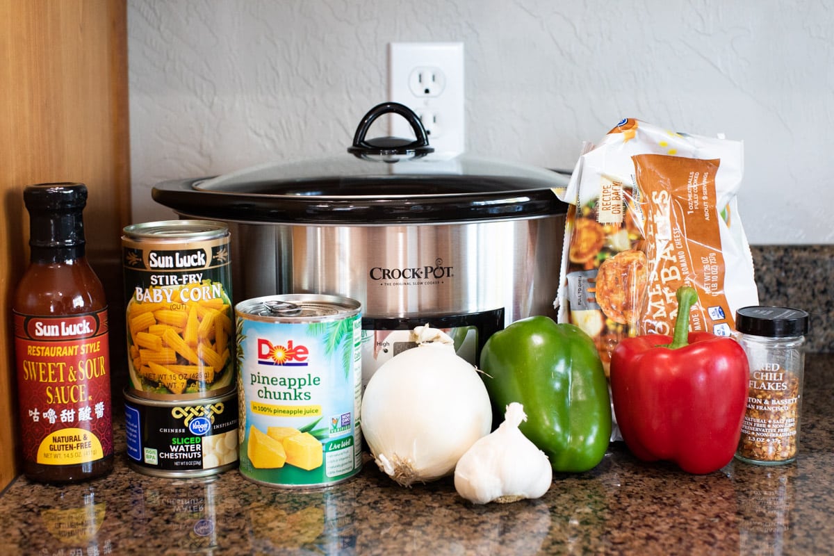 ingredients for sweet and sour meatballs in front of slow cooker