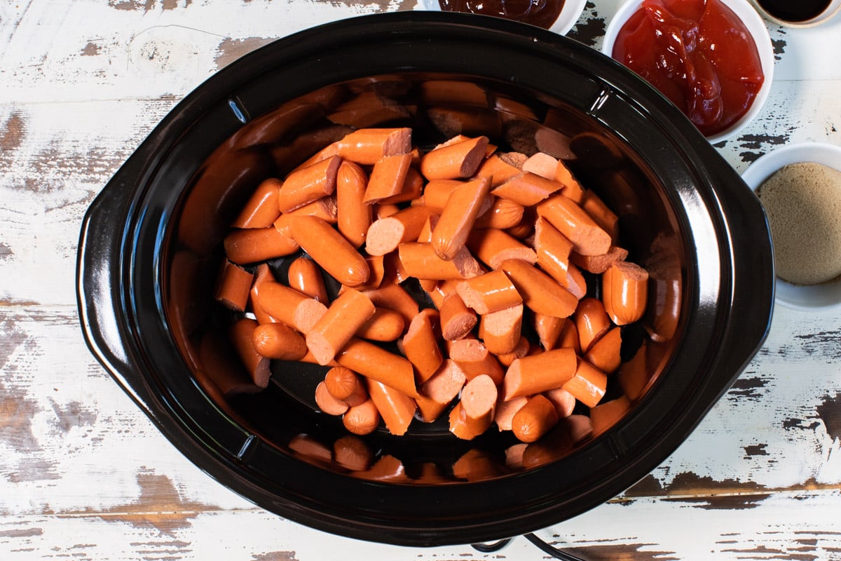 cut hot dogs in slow cooker