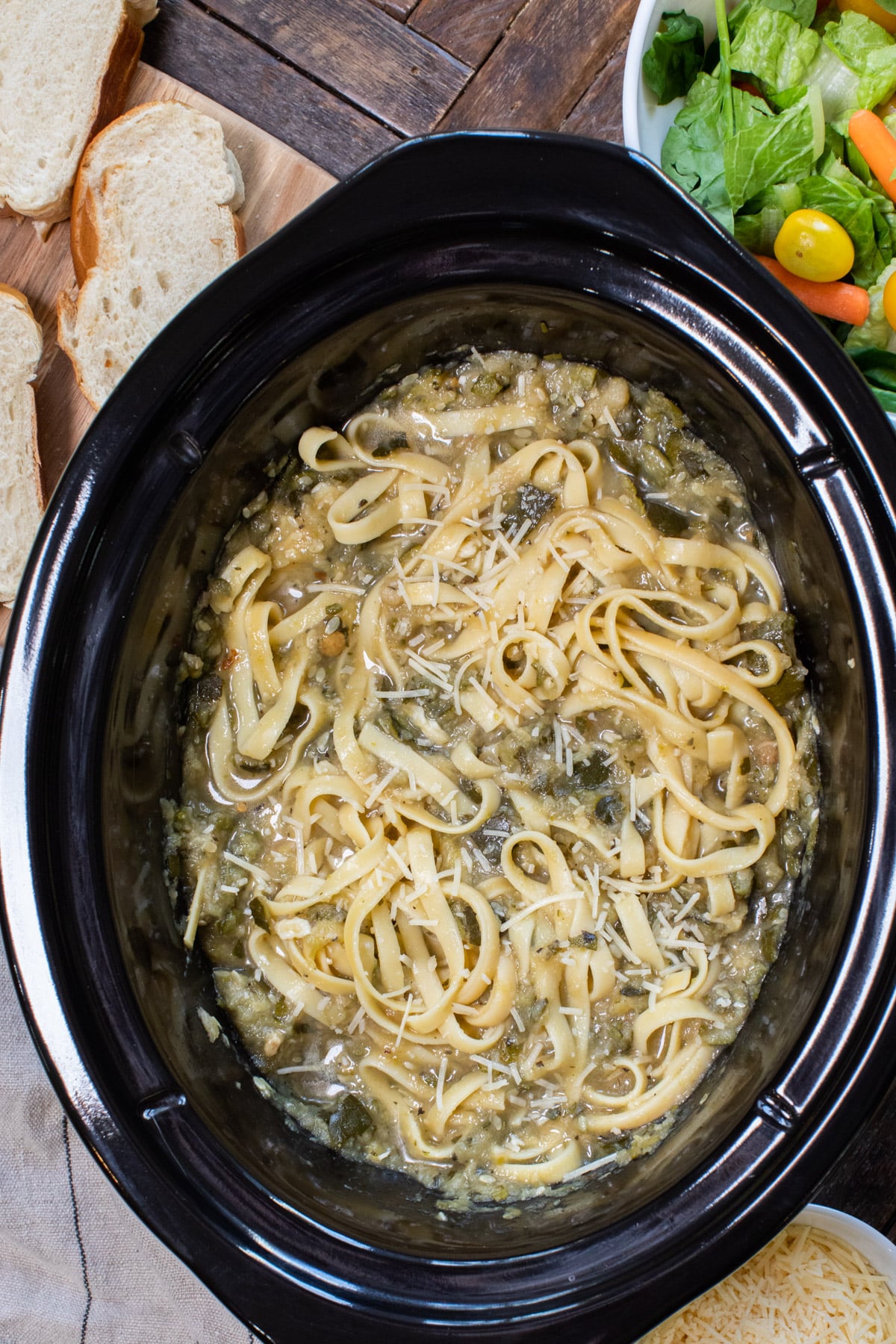 fettuccine with bolognese sauce mixed in, in slow cooker.