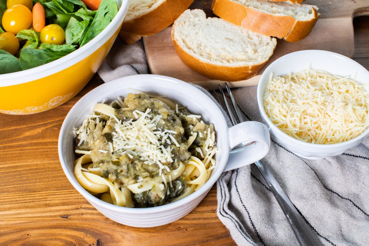 fettuccine with zucchini bolognese on top in bowl