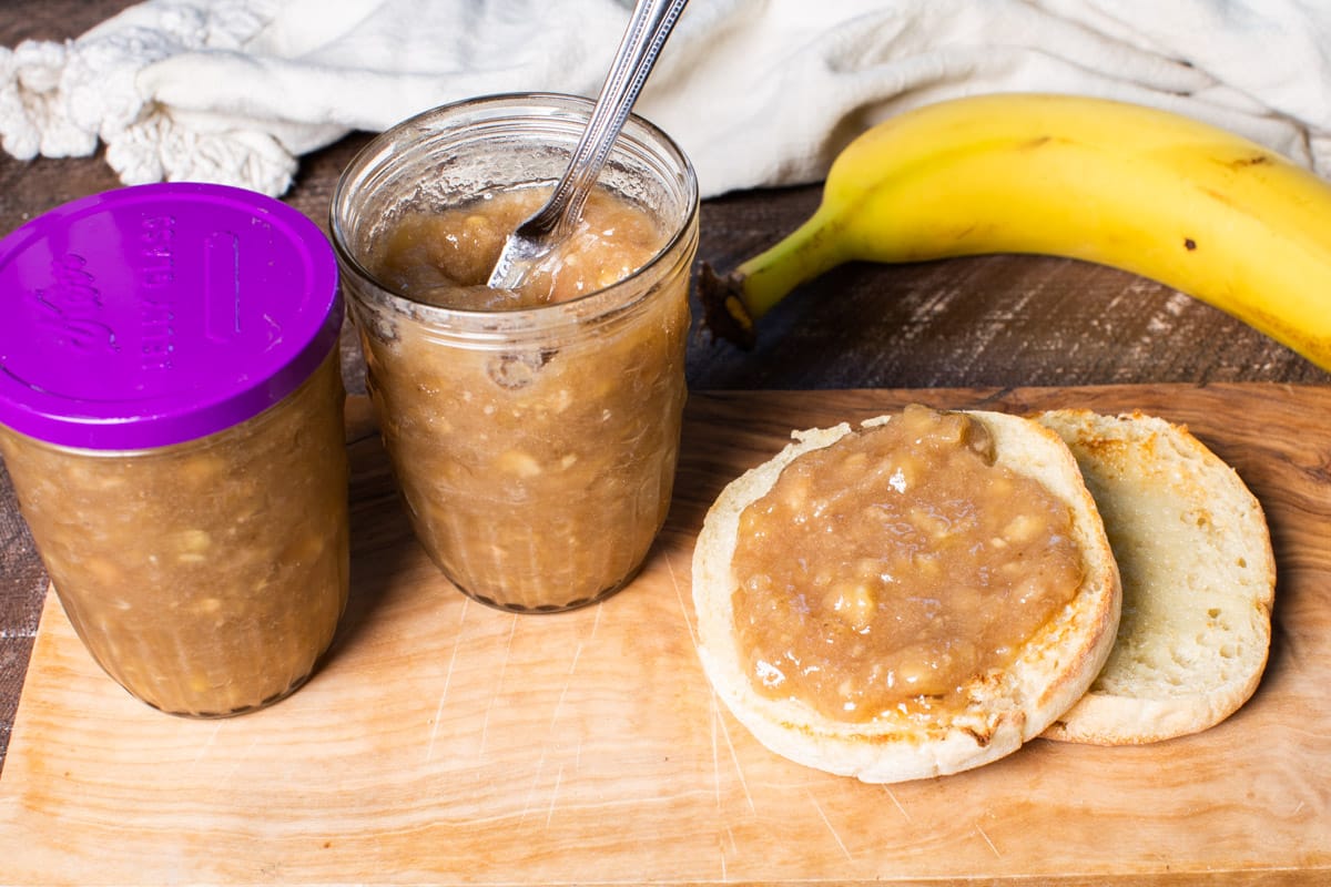 2 jars of banana jam with english muffin on the side