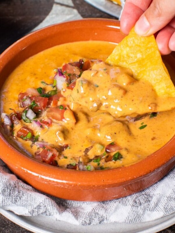 chili cheese dip on a tortilla chip