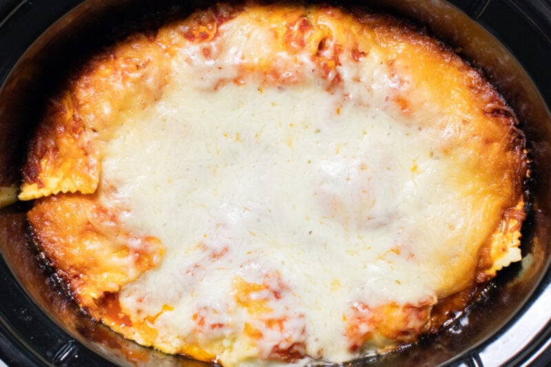 up close image of ravioli lasagna in slow cooker