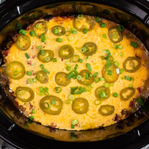 close up image of 7 layer bean dip in slow cooker