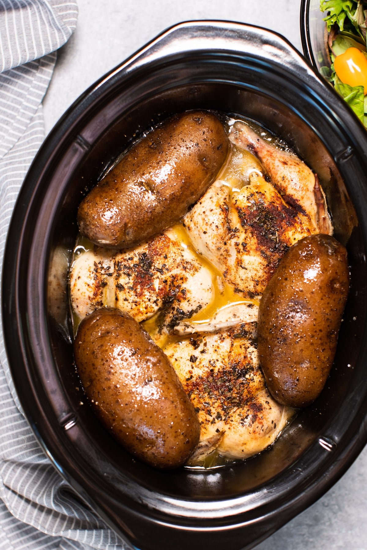 3 game hens and 3 russet potatoes, done cooking in a slow cooker