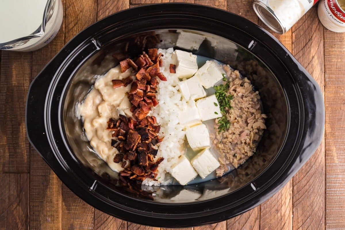 ingredients for clam chowder neatly organized in slow cooker