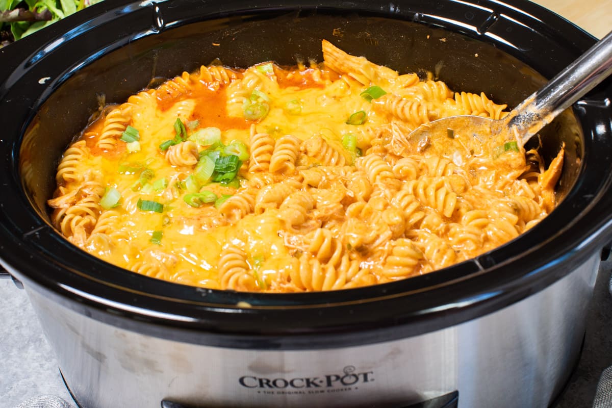 side view of chicken enchilada pasta in slow cooker