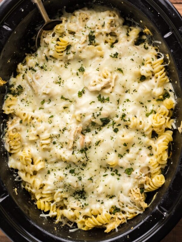 Cooked pesto mozzarella chicken, in the slow cooker.