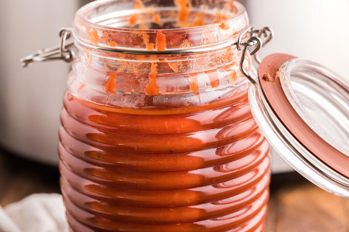 ribbed jar with marinara sauce in it