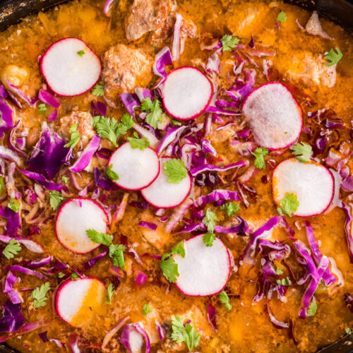 posole with radish and cilantro on top