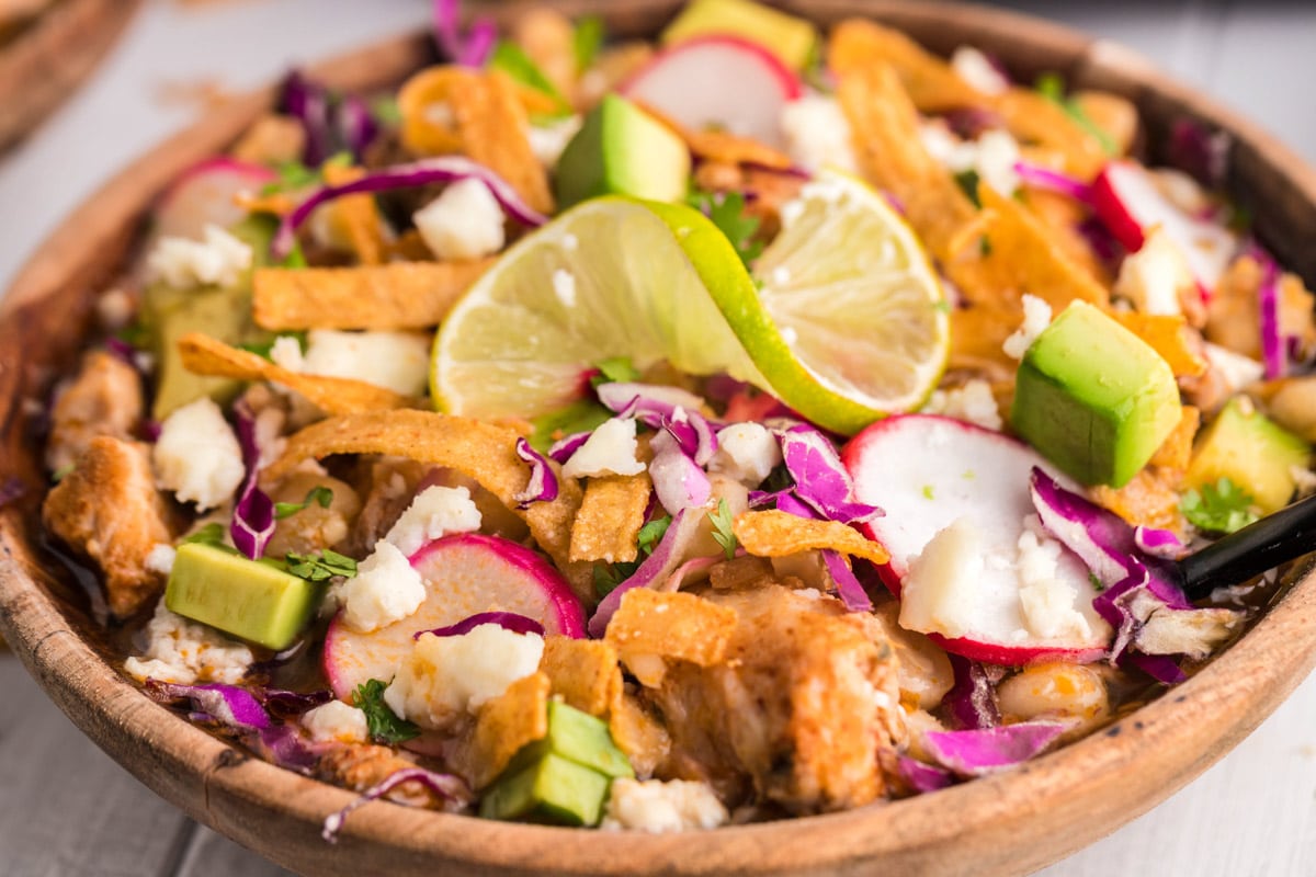 close up of pork pozole in bowl