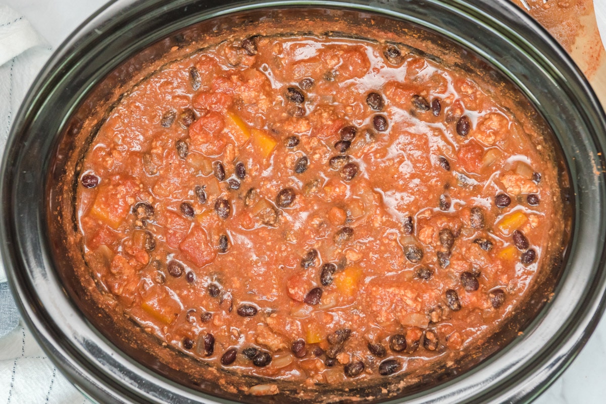 cooked turkey butternut squash chili in a slow cooker