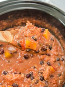 turkey butternut squash chili on wooden spoon