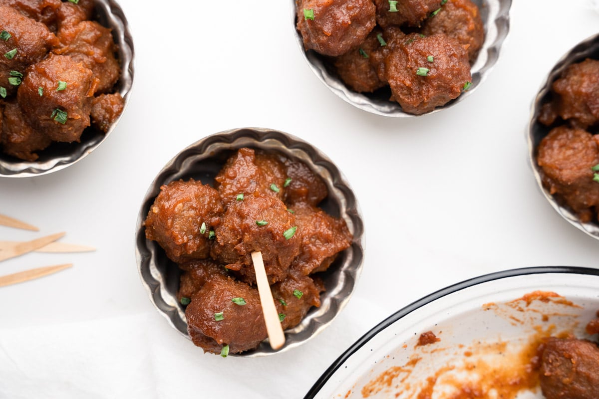 silver bowls with meatballs in them.