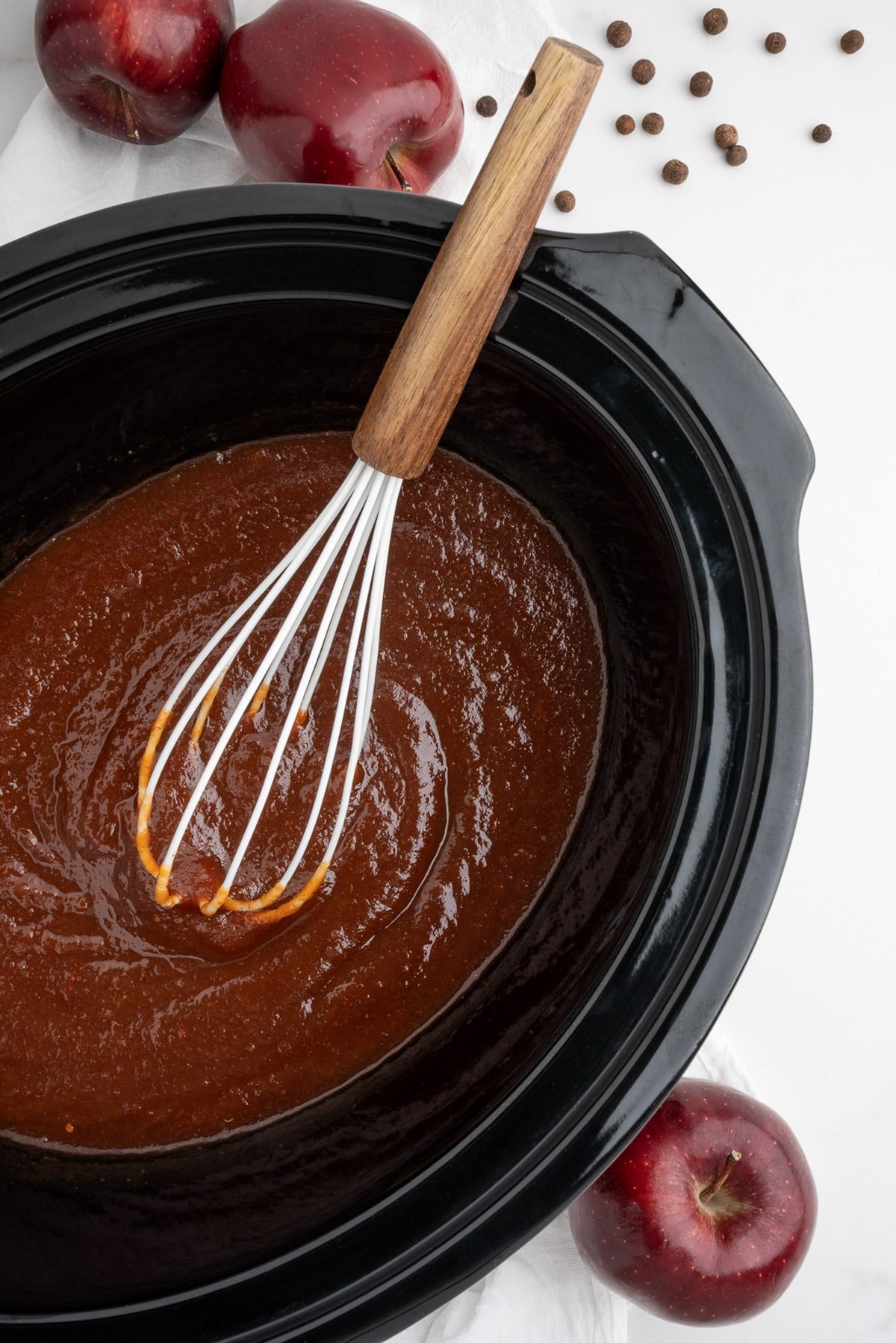 apple butter sauce mixed in a slow cooker.