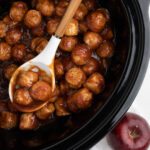 close up of apple butter meatballs in slow cooker