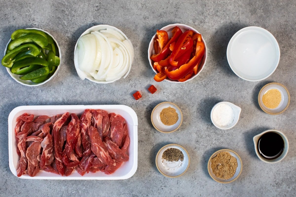 ingredients for pepper steak on a table