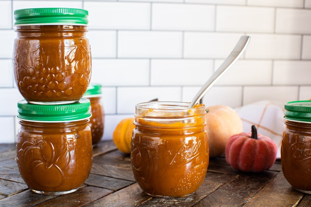 pumpkin butter in jars with green lids