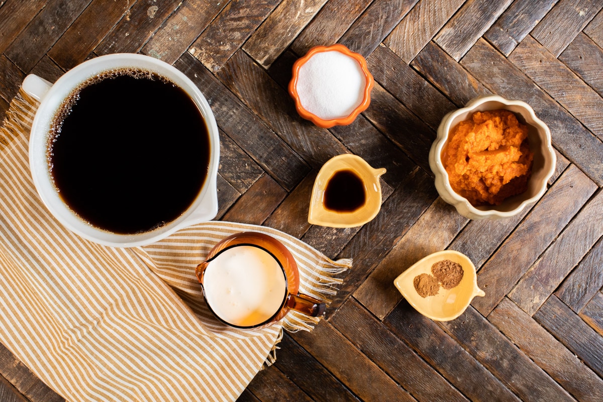 ingredients for pumpkin spice lattes on a table.