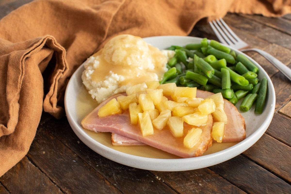 sliced ham with pineapple on a plate