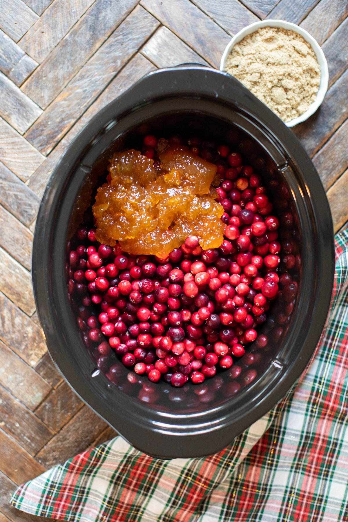 cranberries and orange marmalade in a slow cooker.