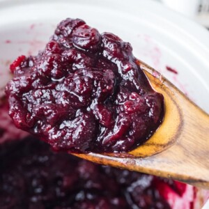 cranberry sauce on wooden spoon