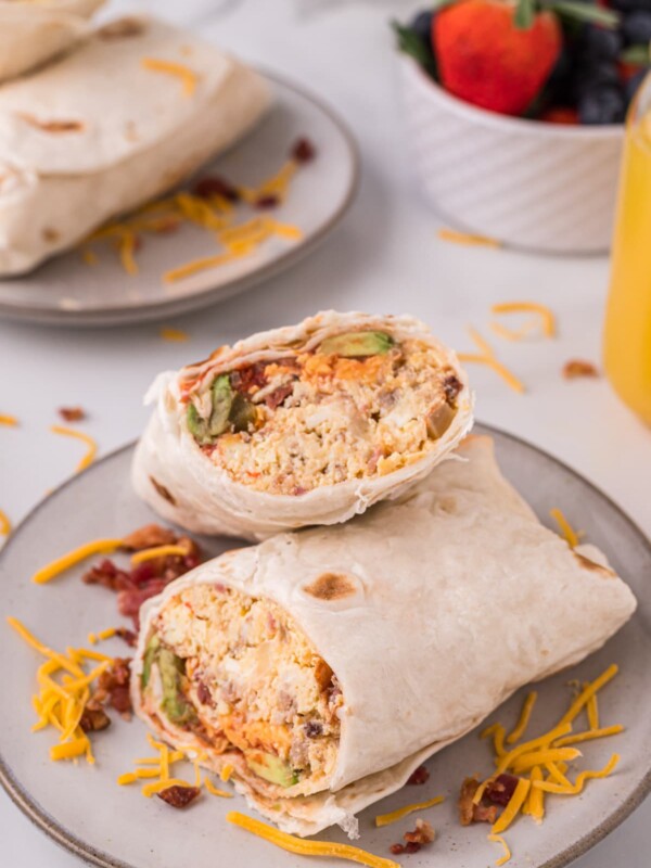 close up of breakfast burrito on plate