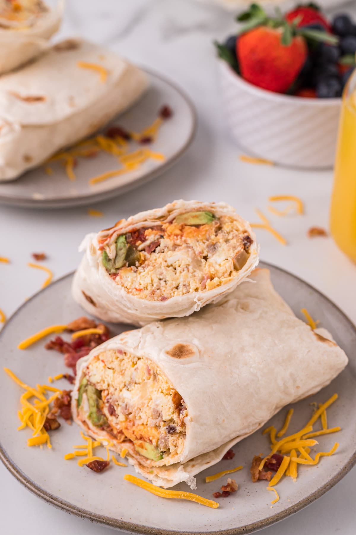 close up of a breakfast burrito on a plate