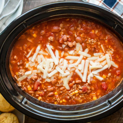 turkey chili in slow cooker with cornbread on the side