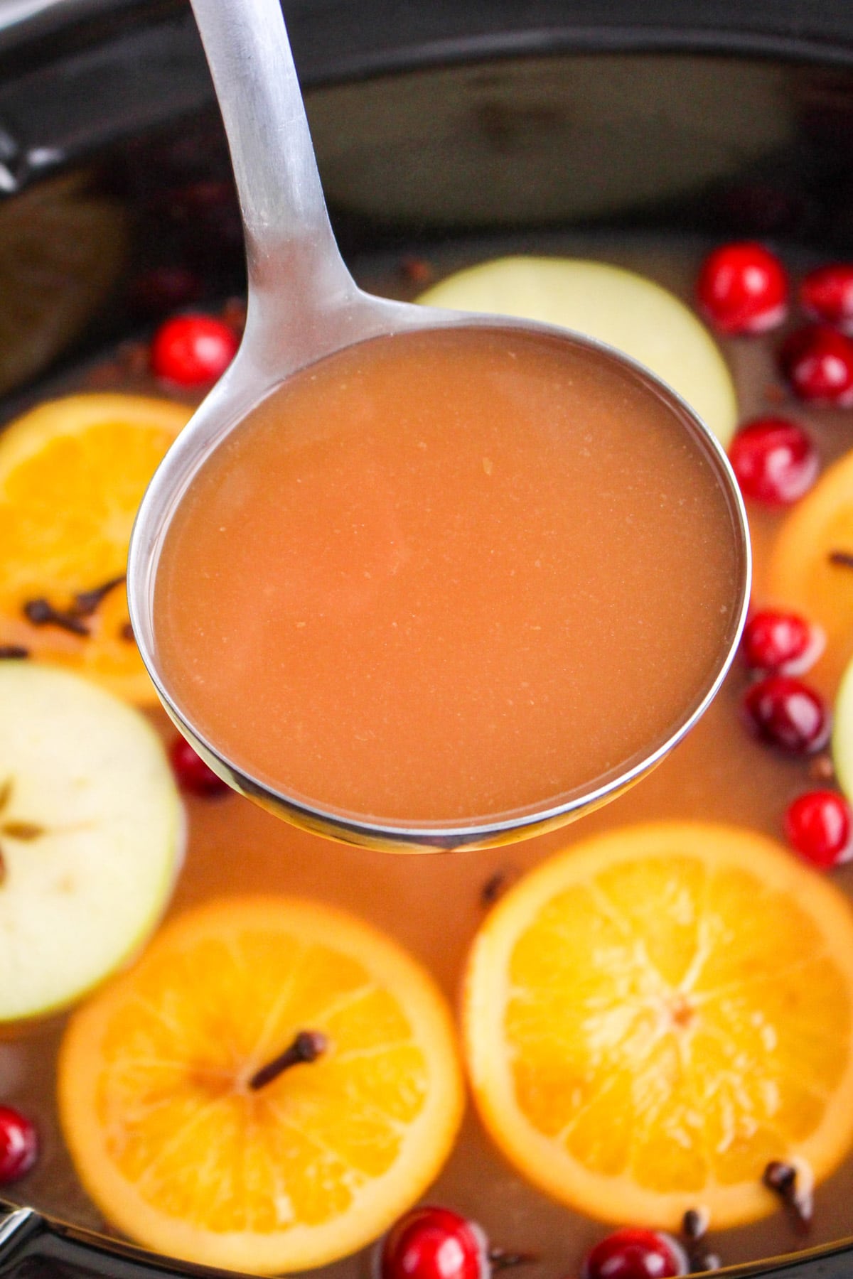 wassail in metal ladle