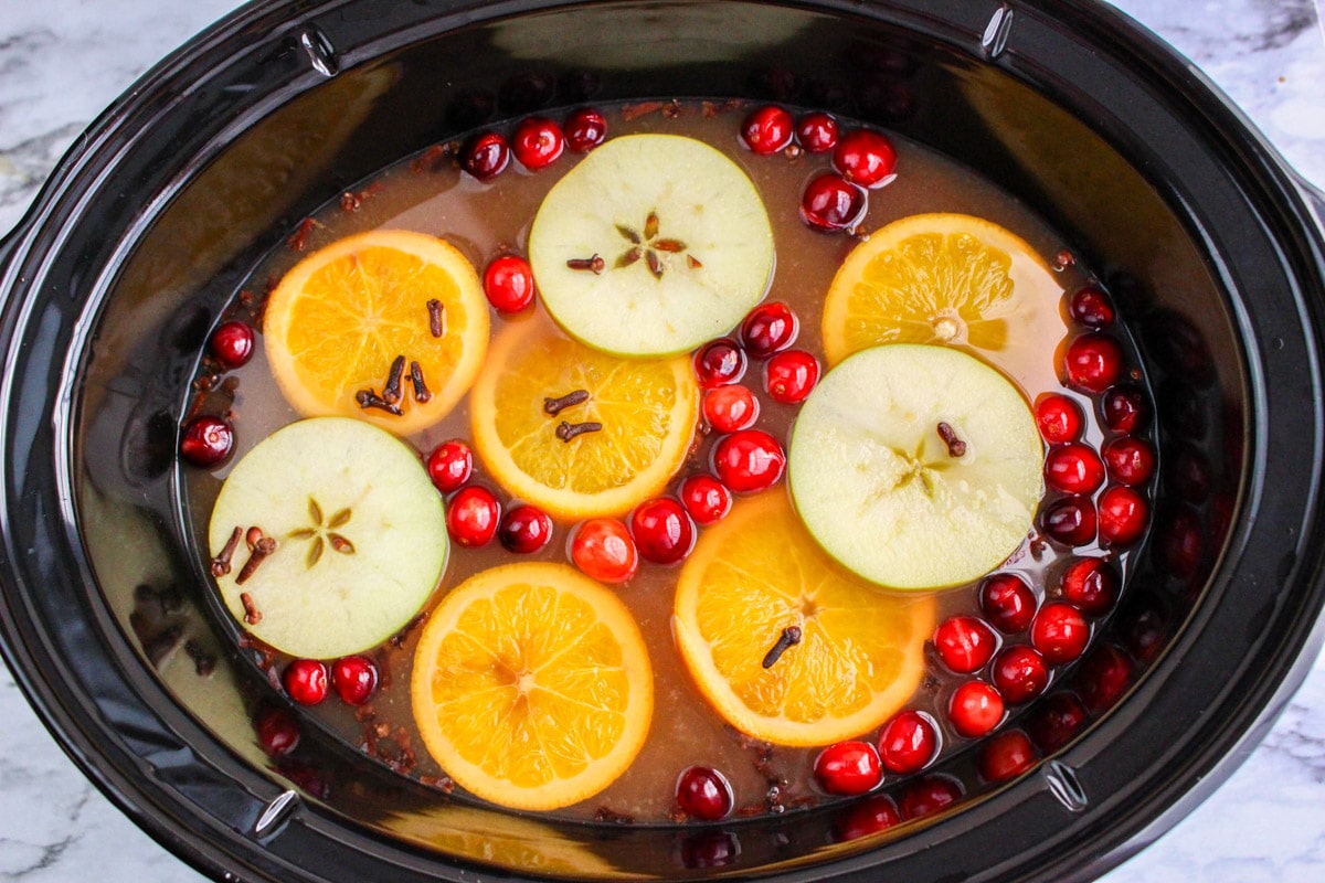 overhead shot of wassail in slow cooker