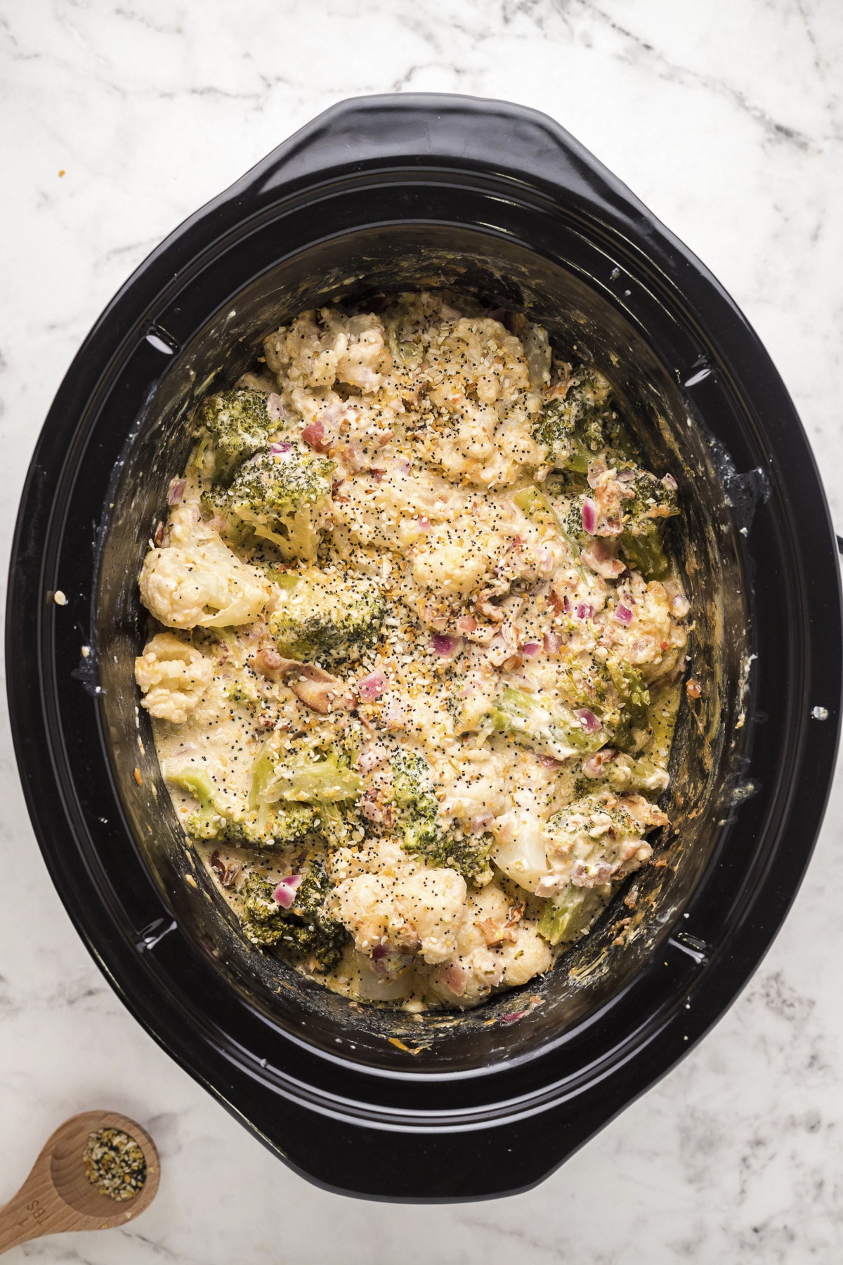 cooked cauliflower and broccoli casserole in slow cooker