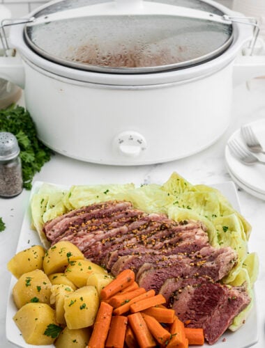tray of corned beef and cabbage in front of slow cooker