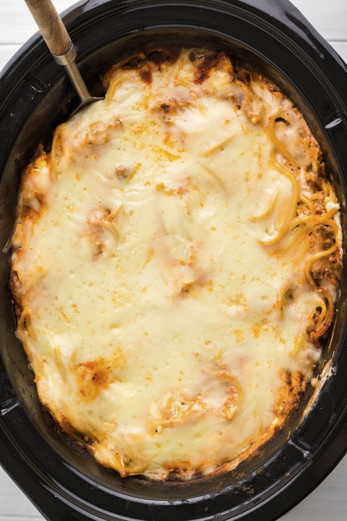 close up of baked spaghetti in slow cooker