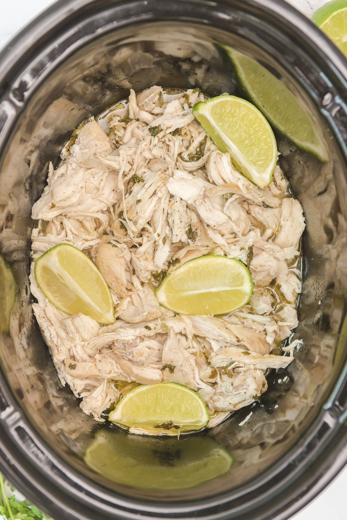 close up of cilantro lime chicken in the slow cooker