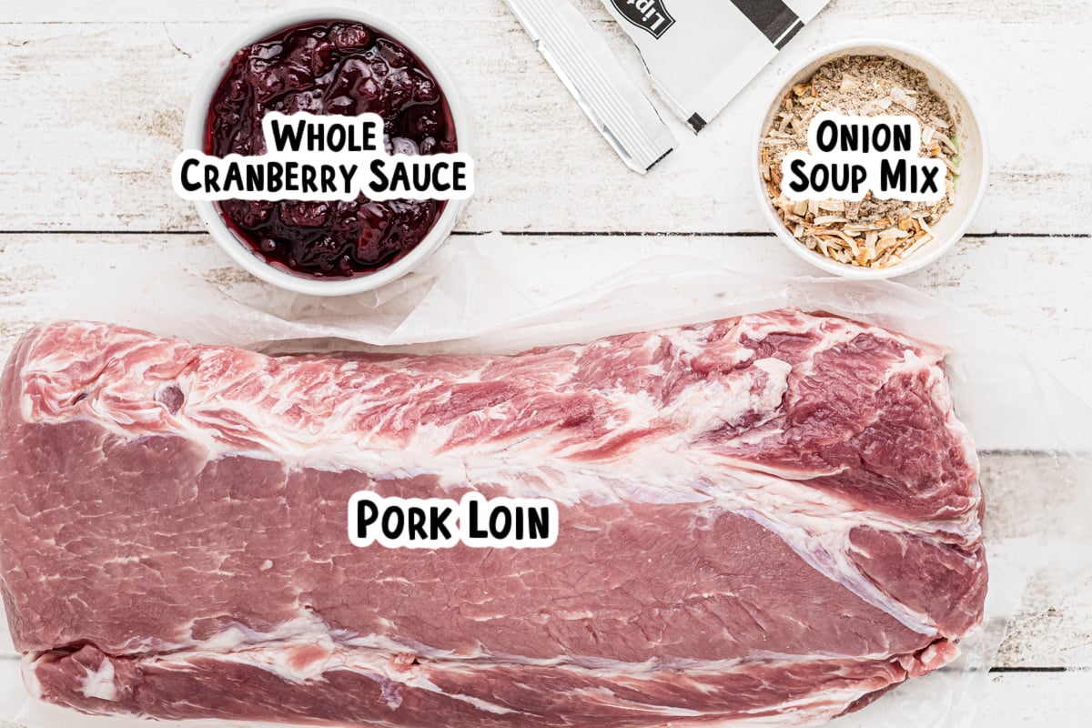 Ingredients for  cranberry pork loin on a table with text labels.