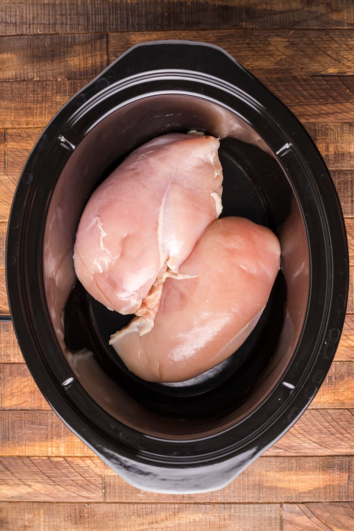 chicken breasts in a slow cooker.