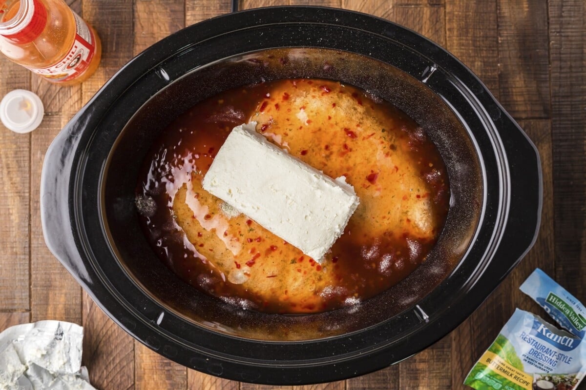 chicken, ranch mix, sweet chili sauce and cream cheese in a slow cooker for sweet chili chicken.